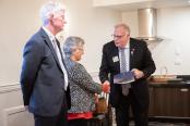 PDG Neil presenting PP Peter Snow and PE Claire Wuth with their PHF